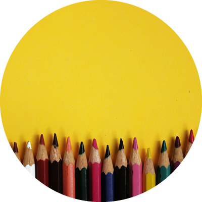 Row of colored pencils on a yellow backgorund representing different requirements